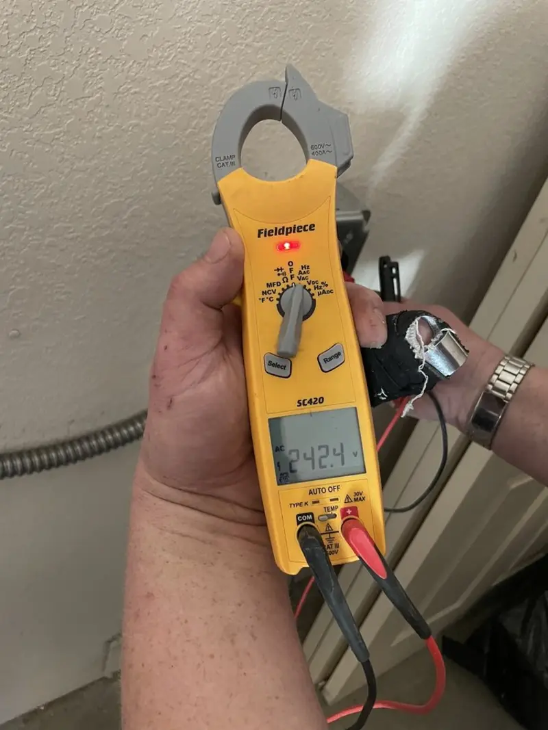 Voltage testing with clamp meter during Outlet Installation in Gloversville